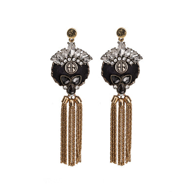alt= "Statement bohemian gold earrings with black agate crystal and metal tassel detailing"